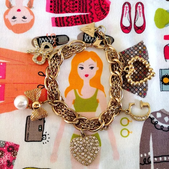 Guess Gold-Tone Romantic Charm Bracelet - Picture 1 of 10